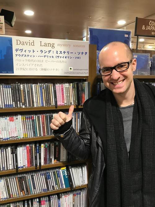 Alumnus Adam Cuthbert in a movie store